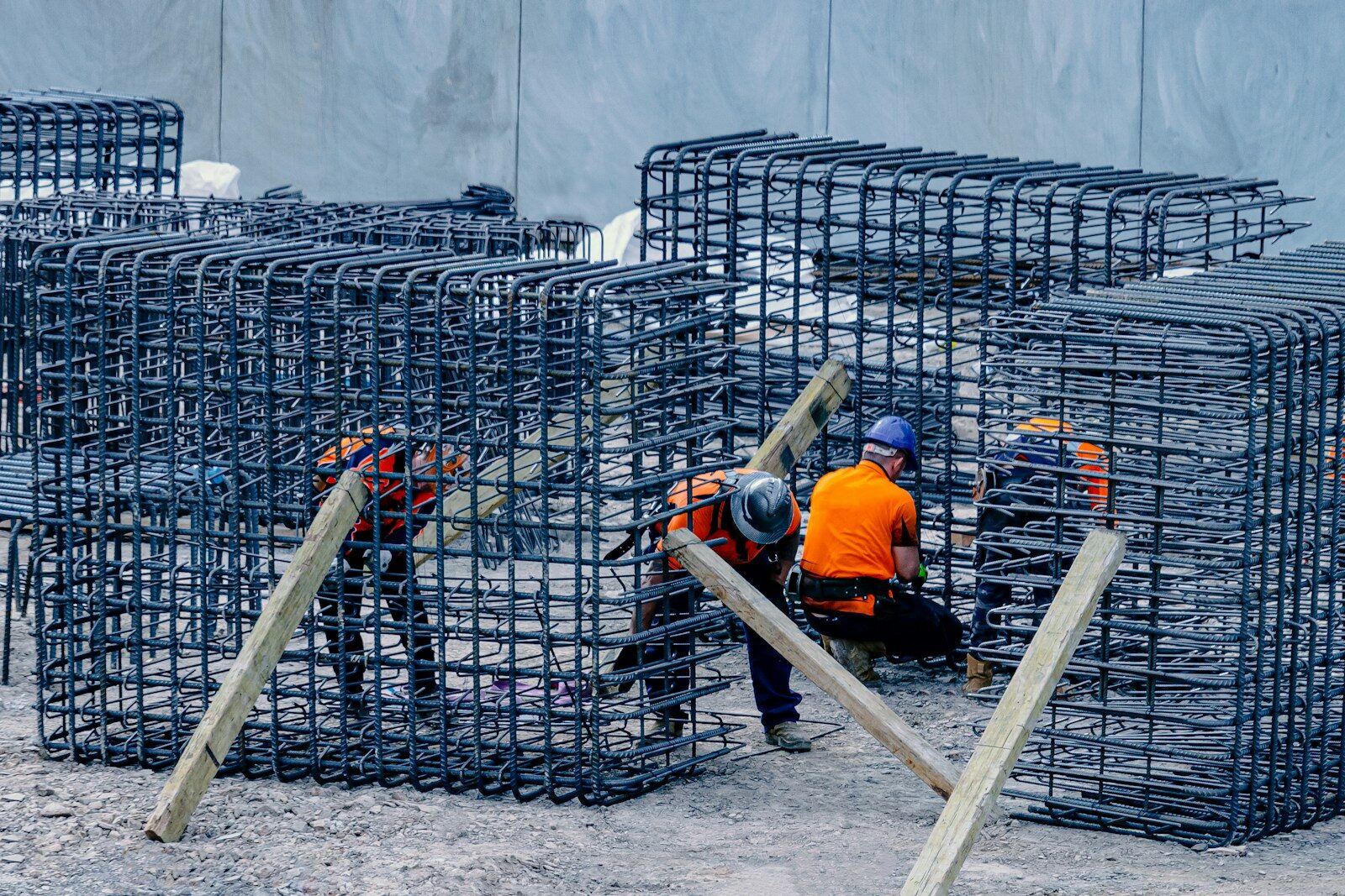 Steel fixers assembling a rebar cage on site